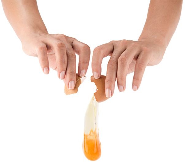 A guy cracking an egg