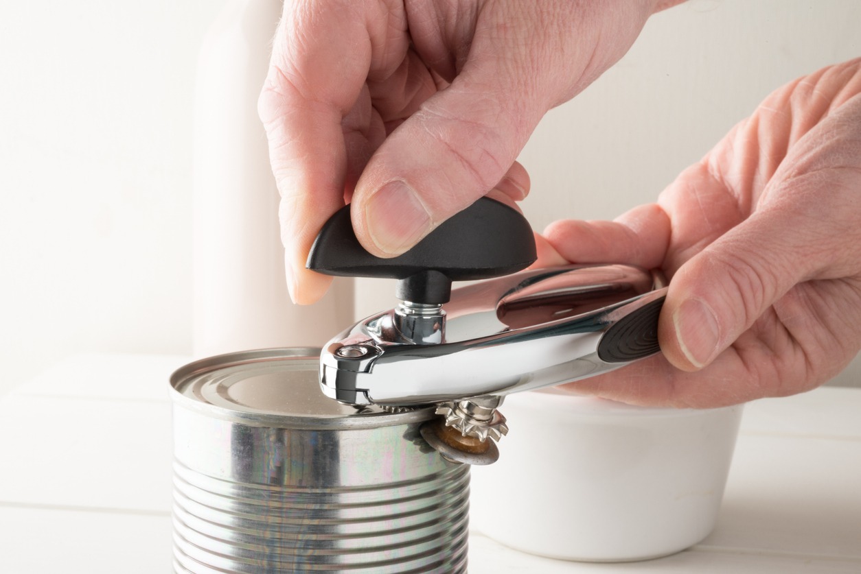 Tin Can Being Opened with a Side Opener