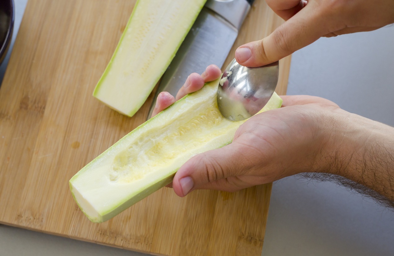 Preparing zuchini hands on the kitchen table