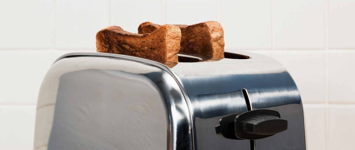 A toaster with two slices of bread