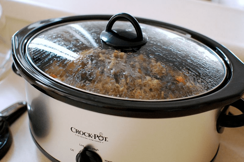 A modern, oval-shaped slow cooker