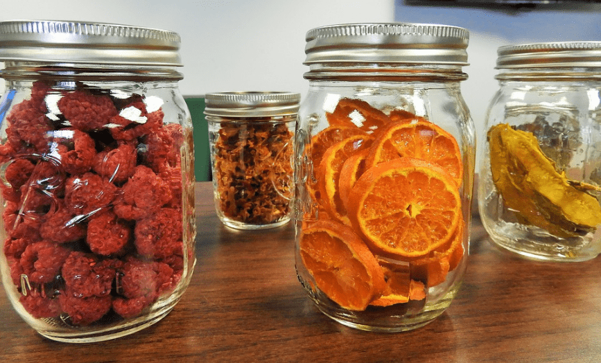 Dehydrated fruits in mason jars.