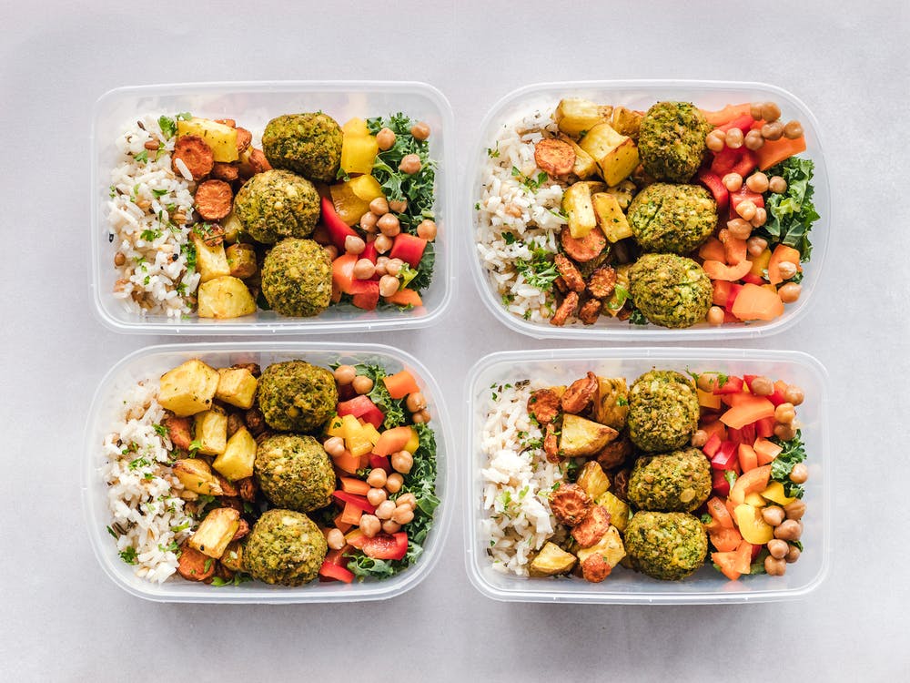 healthy food in four plastic containers