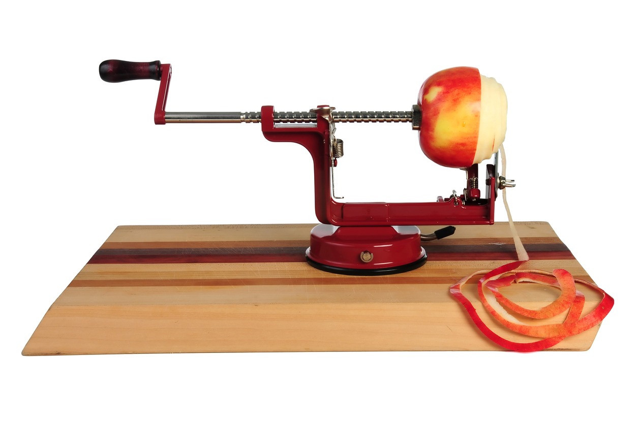 Image of a red mechanical apple peeler