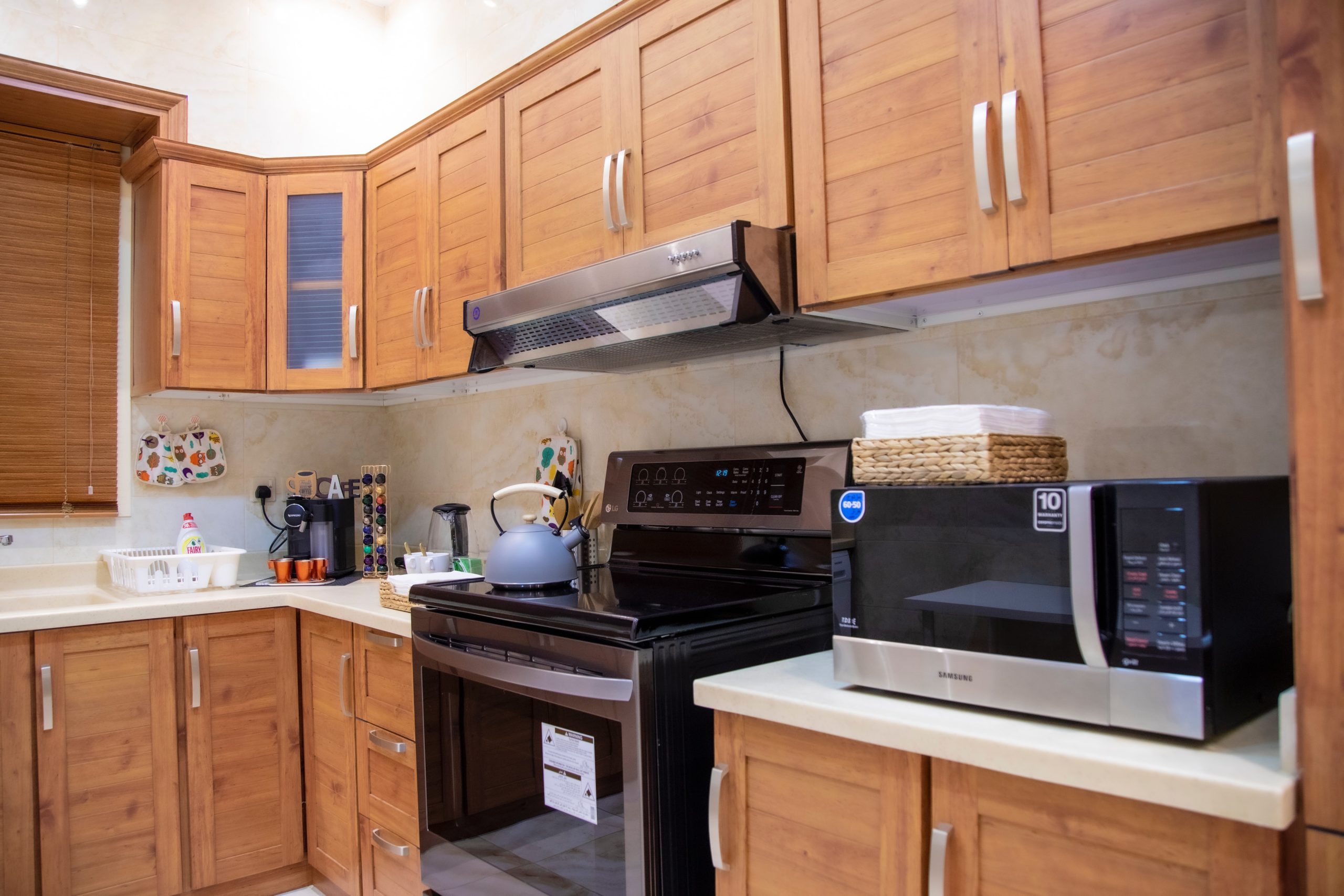 microwave-oven-on-top-of-brown-cabinet